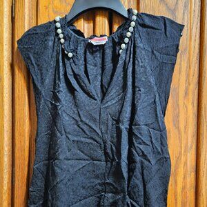 Black Kate Spade cap sleeve top with feau pearls and glitter beads around neck